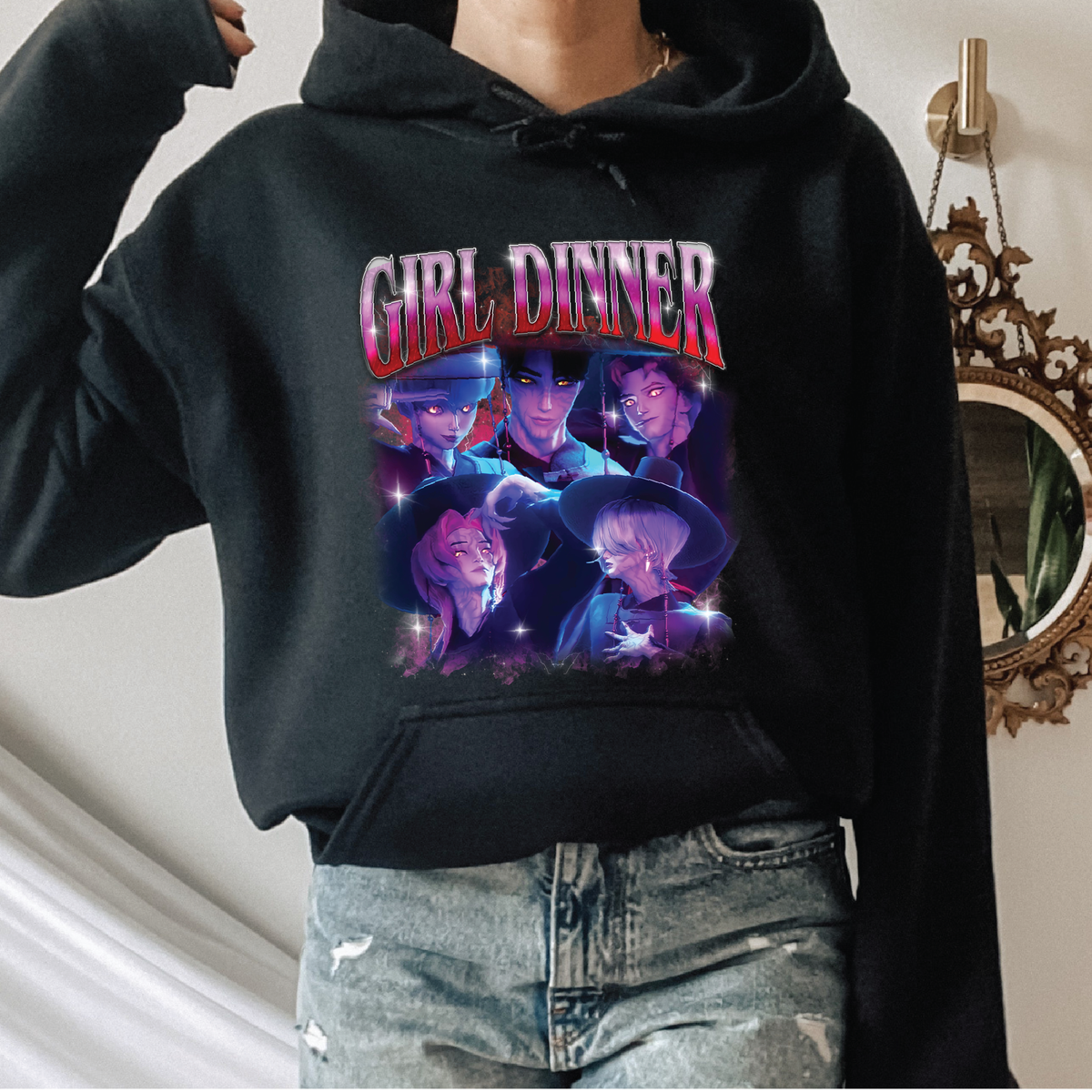 Person wearing a black hoodie with 'Girl Dinner' graphic design. Huntrx K-pop demon hunters