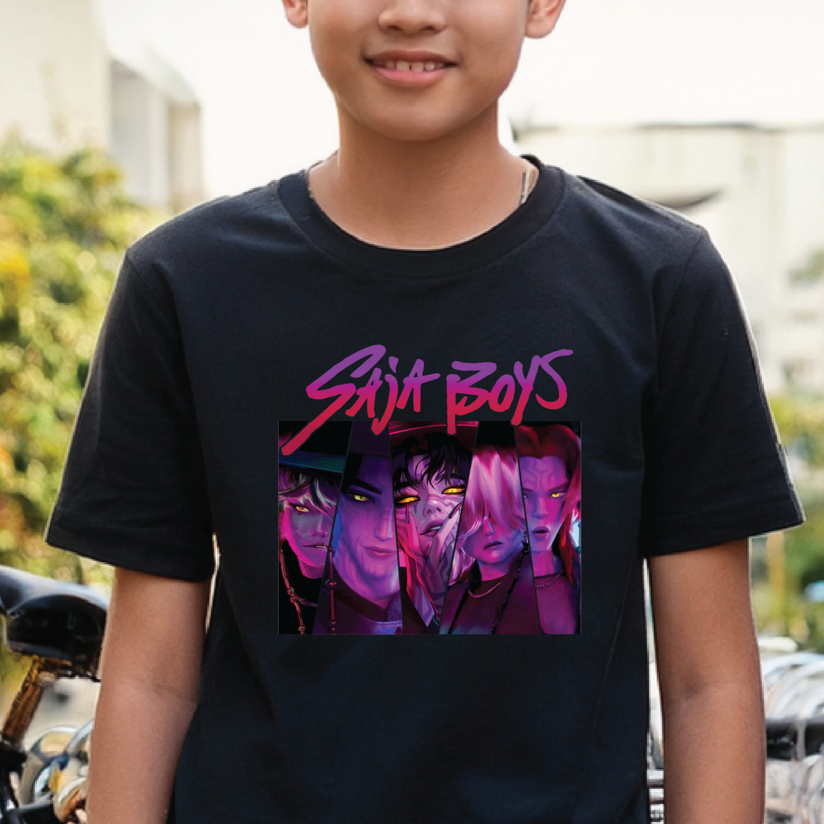 Person wearing a black t-shirt with a graphic design and text. Design is of Saja Boys, K-pop Demon Hunters