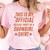 Person wearing a pink t-shirt with text about a showgirl shirt release party.