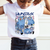 Child wearing a white t-shirt with blue cat illustrations and 'HUNTRAX' text.