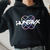 Person wearing a black hoodie with 'HUNTRX' logo.