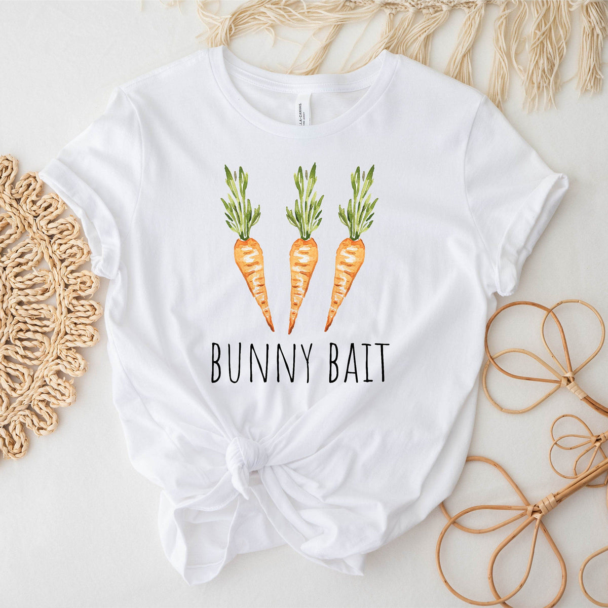 White t-shirt with carrot design and 'Bunny Bait' text on a light background
