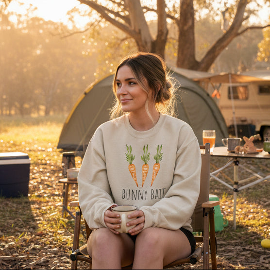 Man in a field with a tree and fence in the background