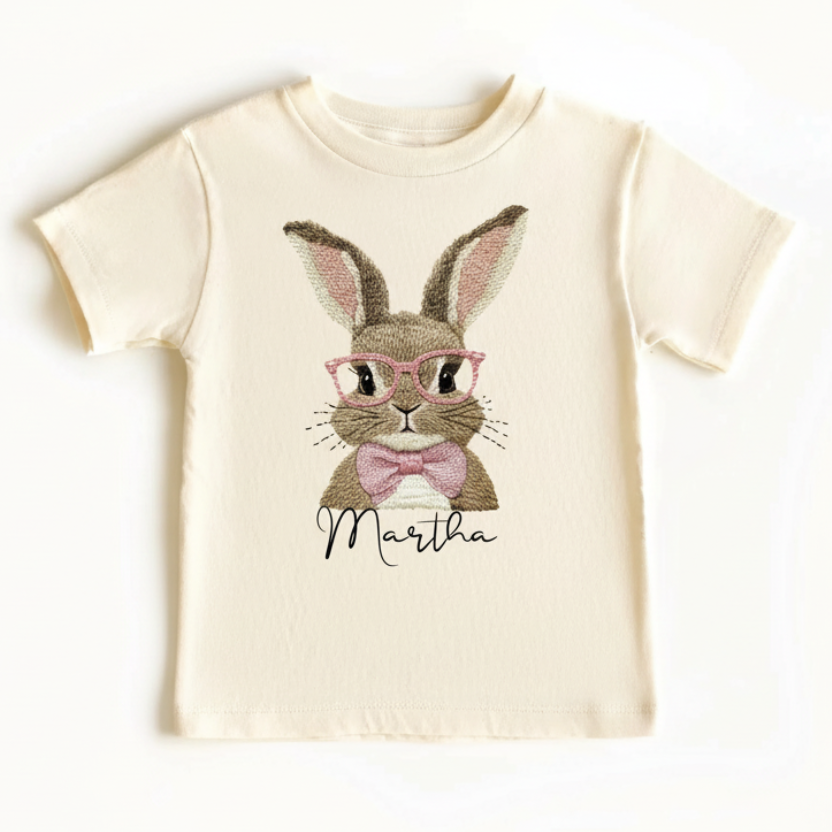 Beige t-shirt with a rabbit graphic and 'Martha' text on a white background