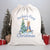 A white Santa sack with the name 'Archie's First Christmas 2023' printed on it, featuring an illustration of Peter Rabbit holding a Christmas tree.