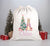 A white Santa sack with a floral pattern, featuring an illustration of a rabbit, a Christmas tree, and presents. The name 'Chloe' is printed in pink on the front.